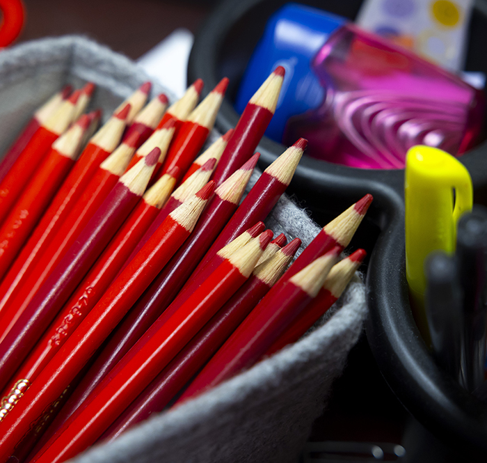 Red pencils in a gray box