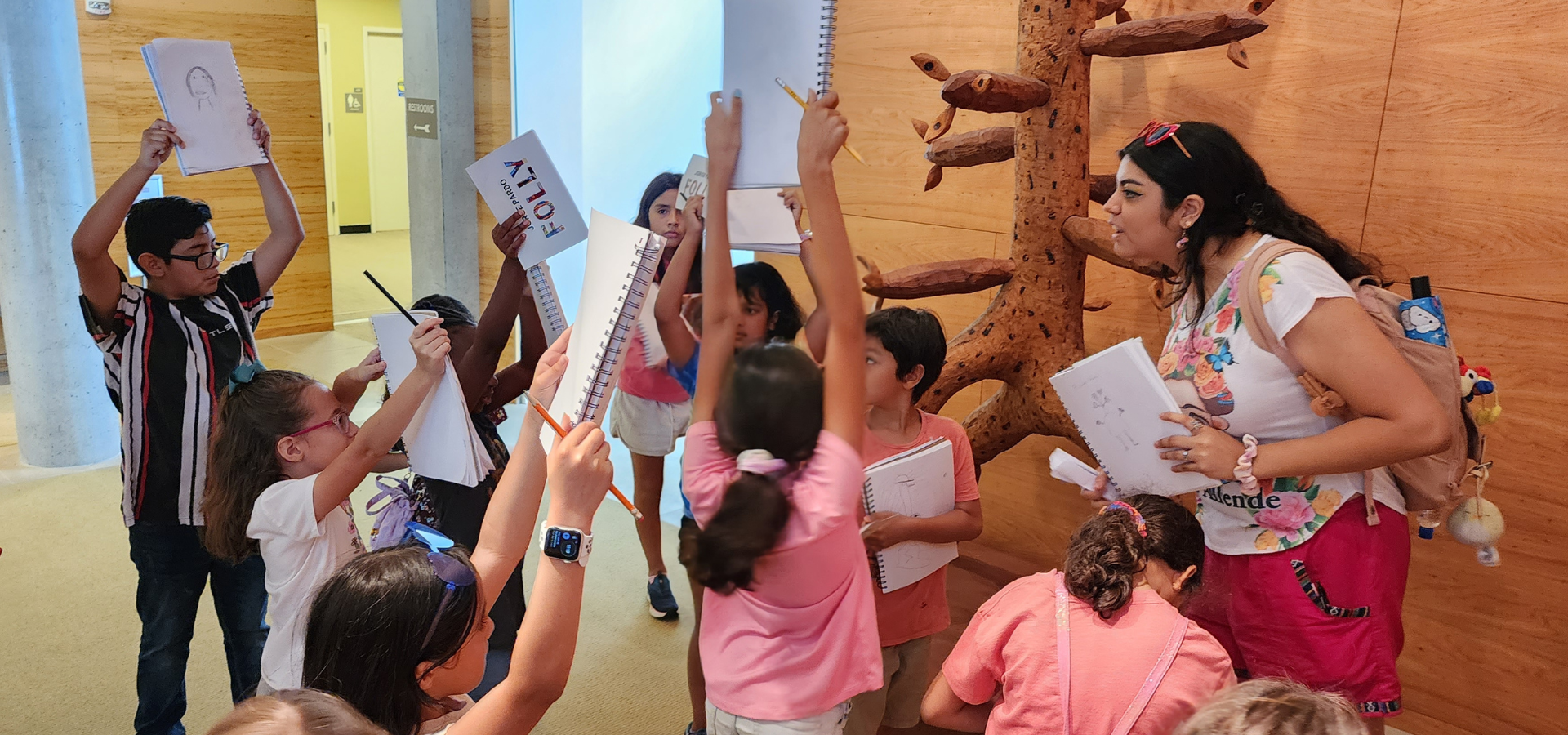 A UH Summer Teaching Artist leading an interactive arts field trip