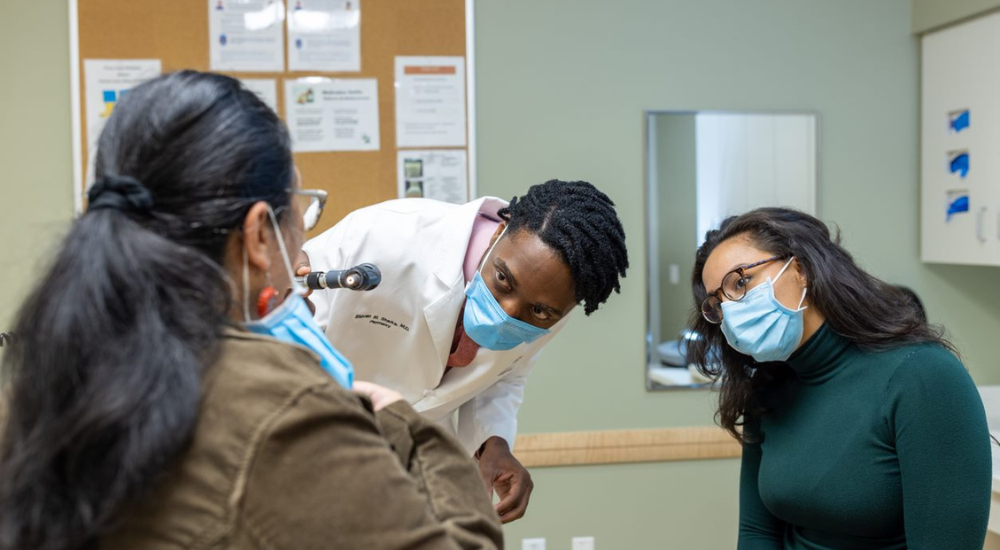 Medical preceptor instructing student