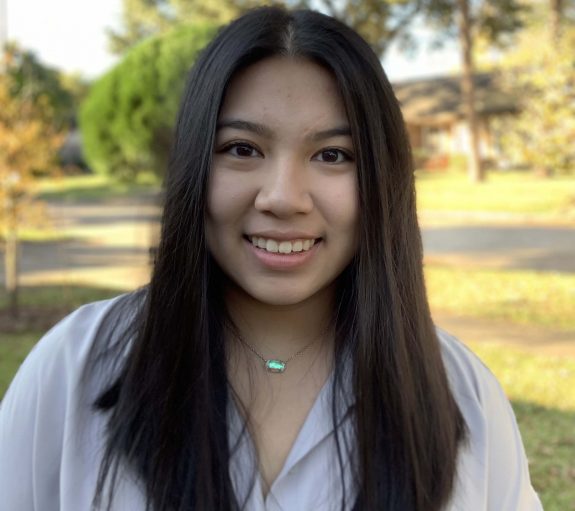 Portrait of an asian woman smiling outside