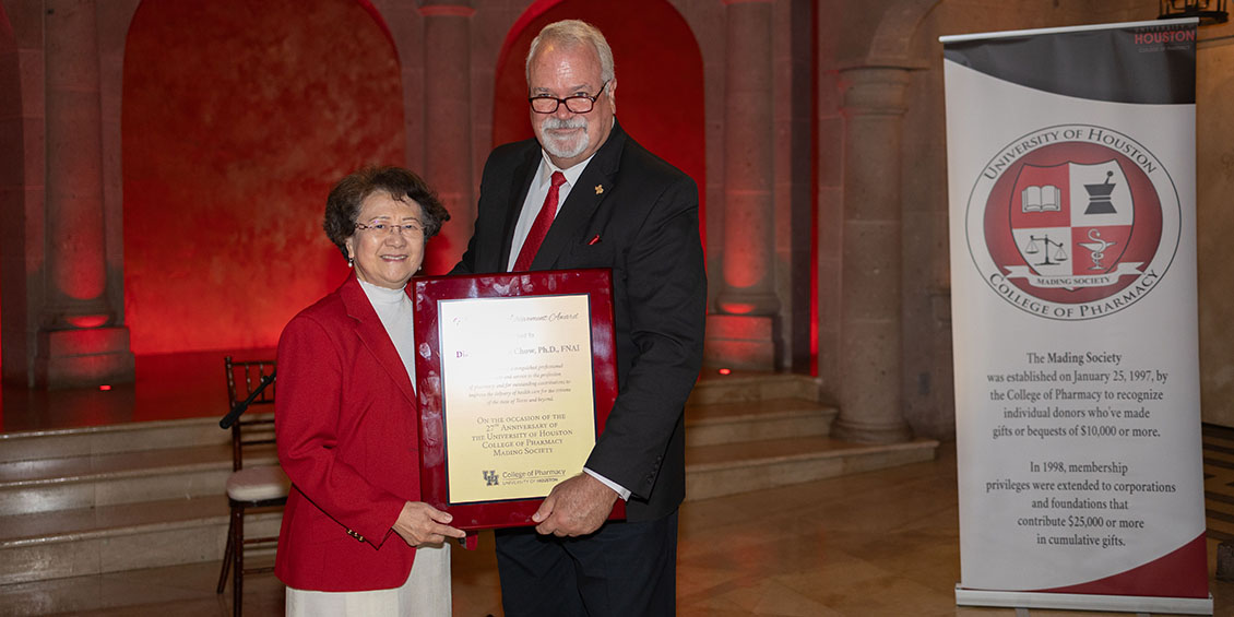 Diana Chow is presented with the 2023 Meritorious Achievement Award by Dean Lamar Pritchard.