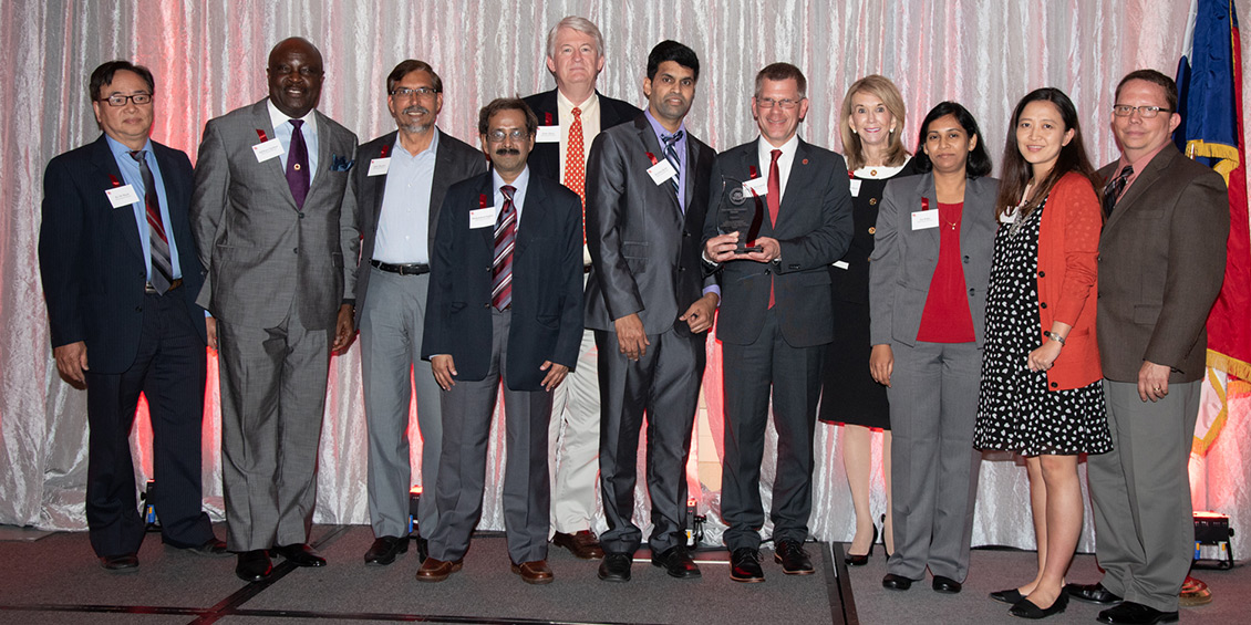 photo of award-winning instructors and provost