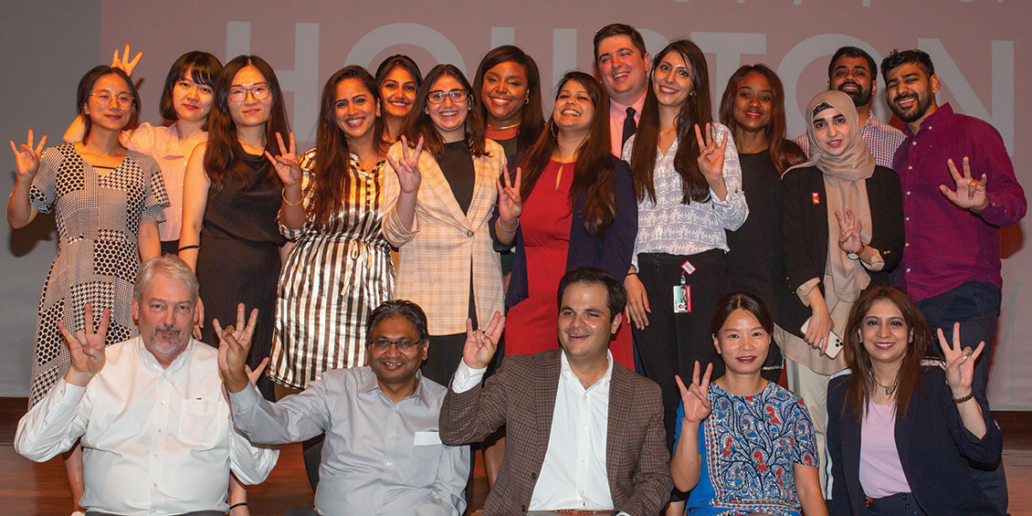 phop students and faculty make uh cougars sign